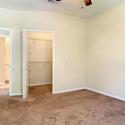 Bedroom with walk-in closet